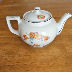 Floral Ceramic Teapot with Orange and Blue Accents
